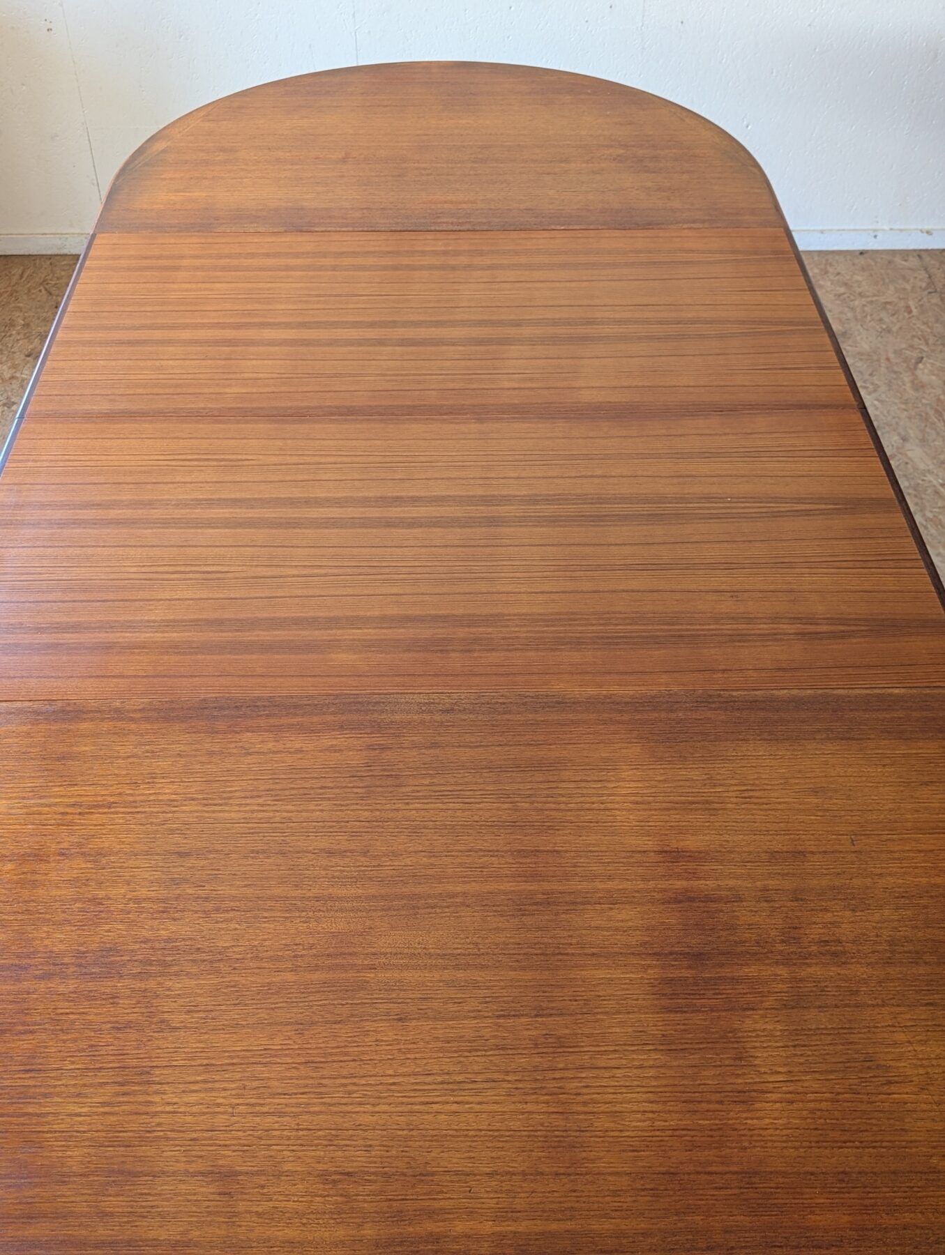 Scandinavian teak oval table from the 1960s, extendable up to 243 cm.
