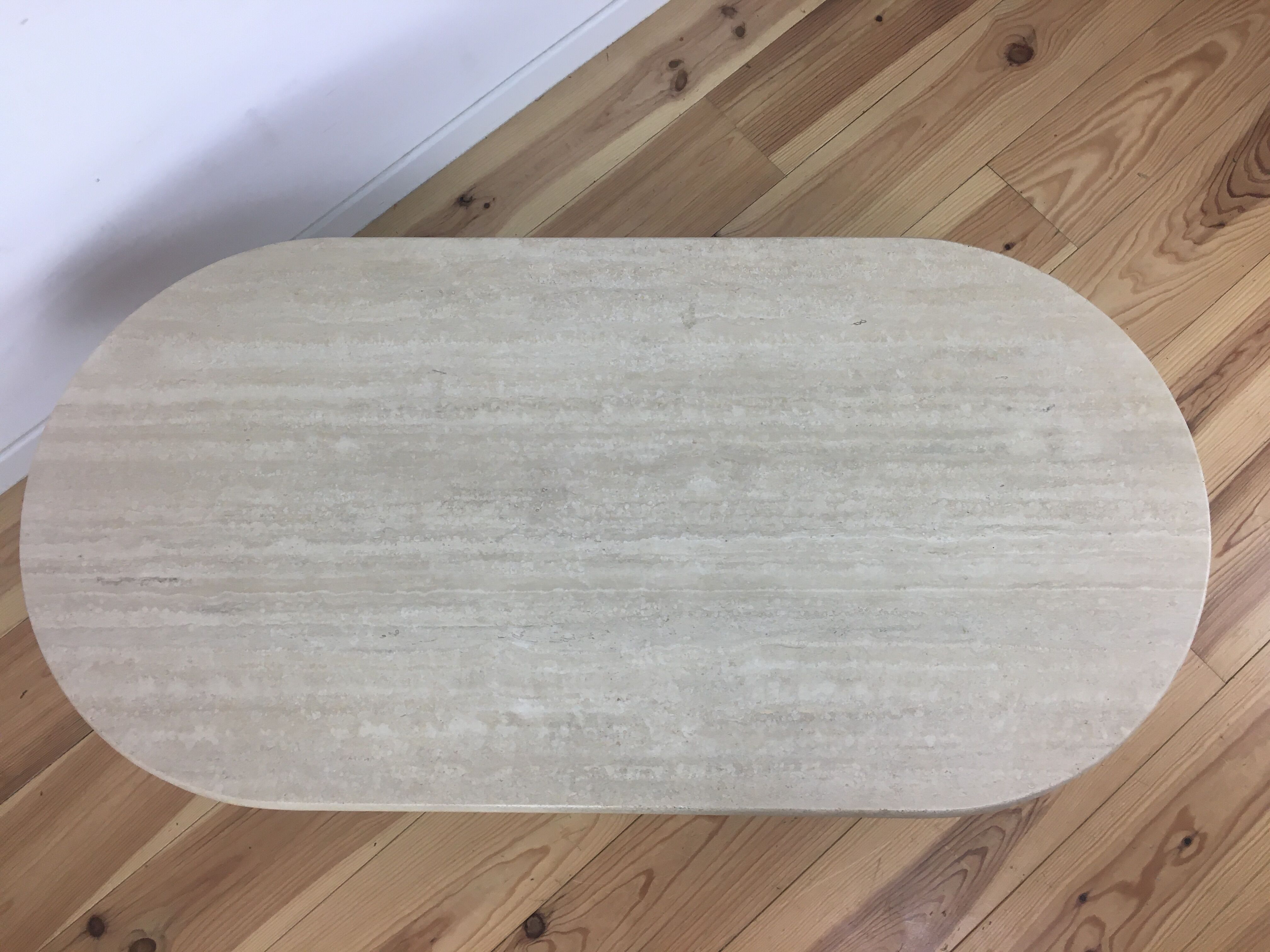 Oval coffee table in travertine