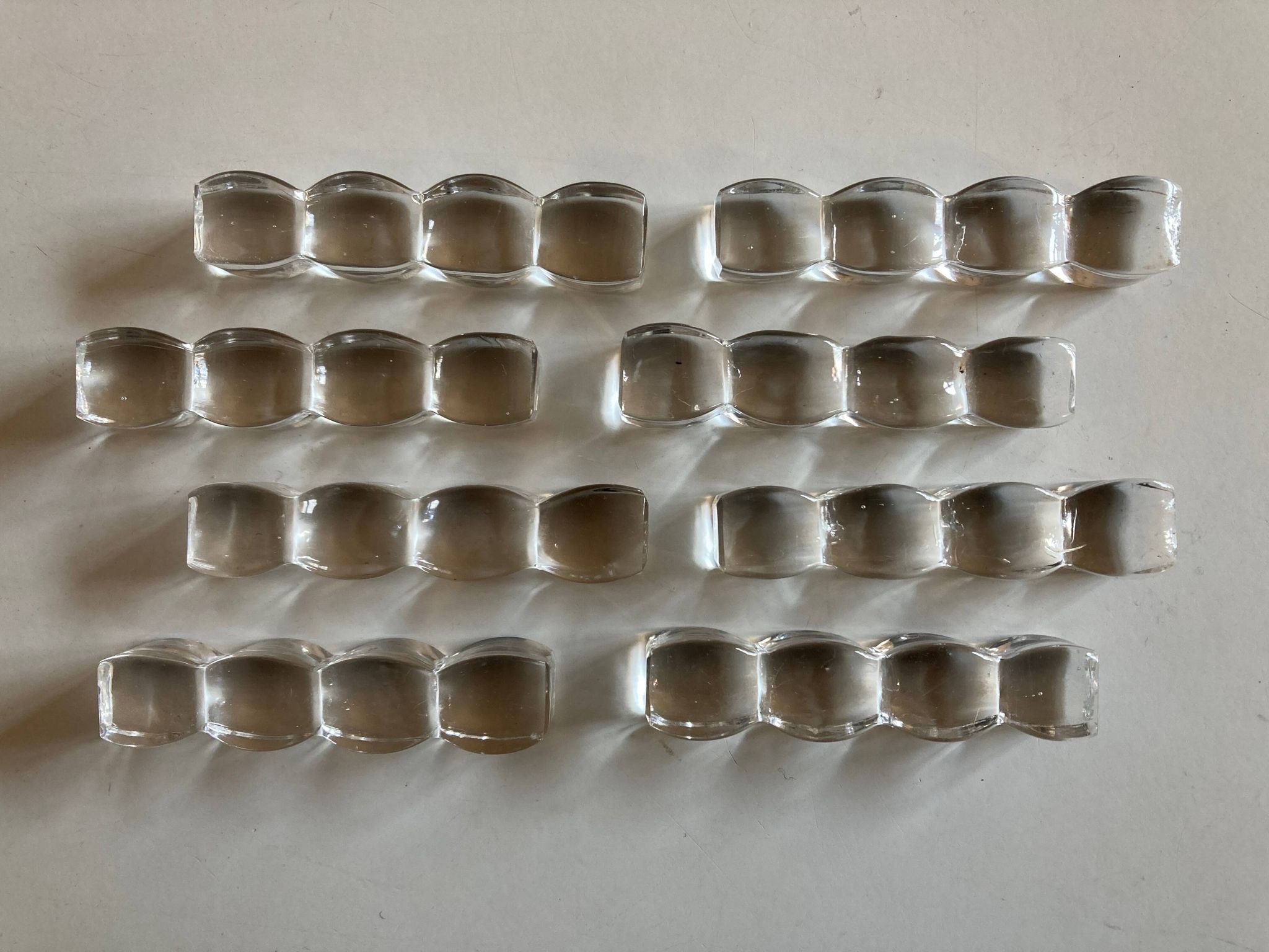Set of 8 modernist crystal knife rests from the 1940s.
