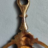 Antique hand-facing mirror in bronze and beveled glass