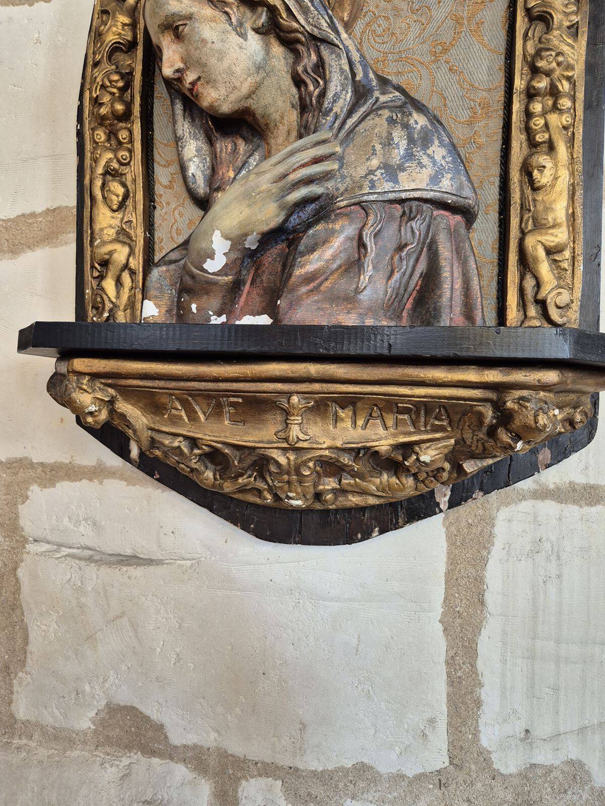 Ancient bas-relief in wood and stucco