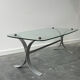 Design coffee table in brushed metal with a glass top, 1970s.