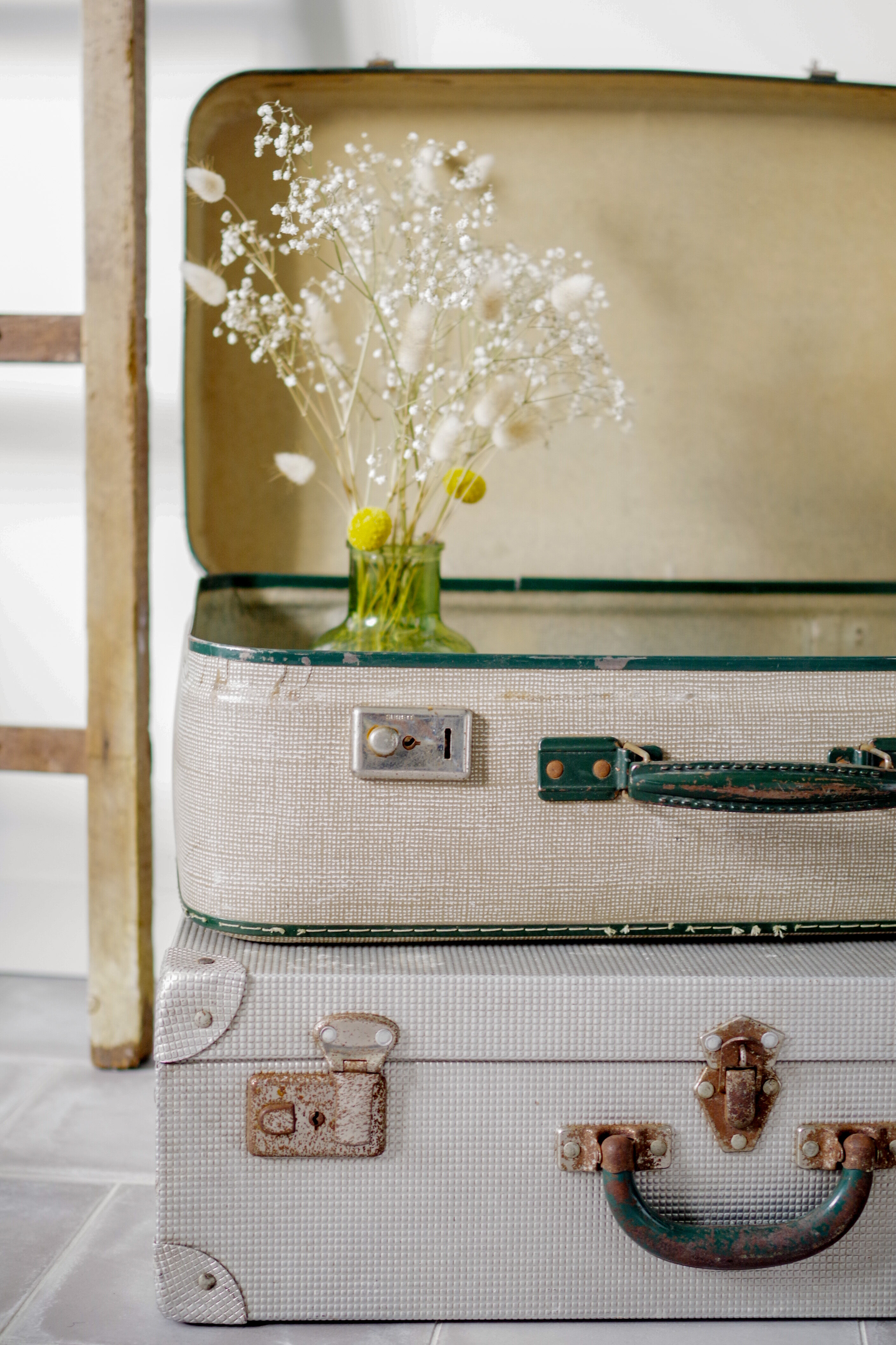 Old cream and green coloured suitcase