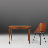 Side table with sculpted elements and rattan top