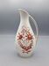 Hand painted German porcelain pitcher with floral design and gold trim