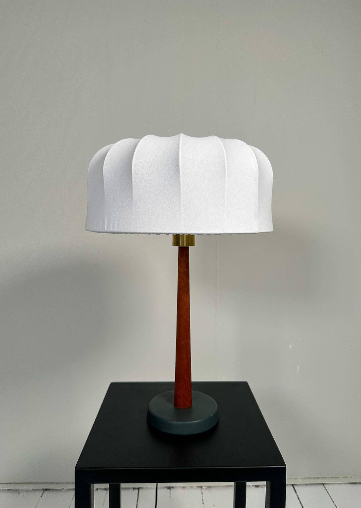 Mid-century teak and cotton table lamp by Einar Bäckström, Sweden, 1950s.