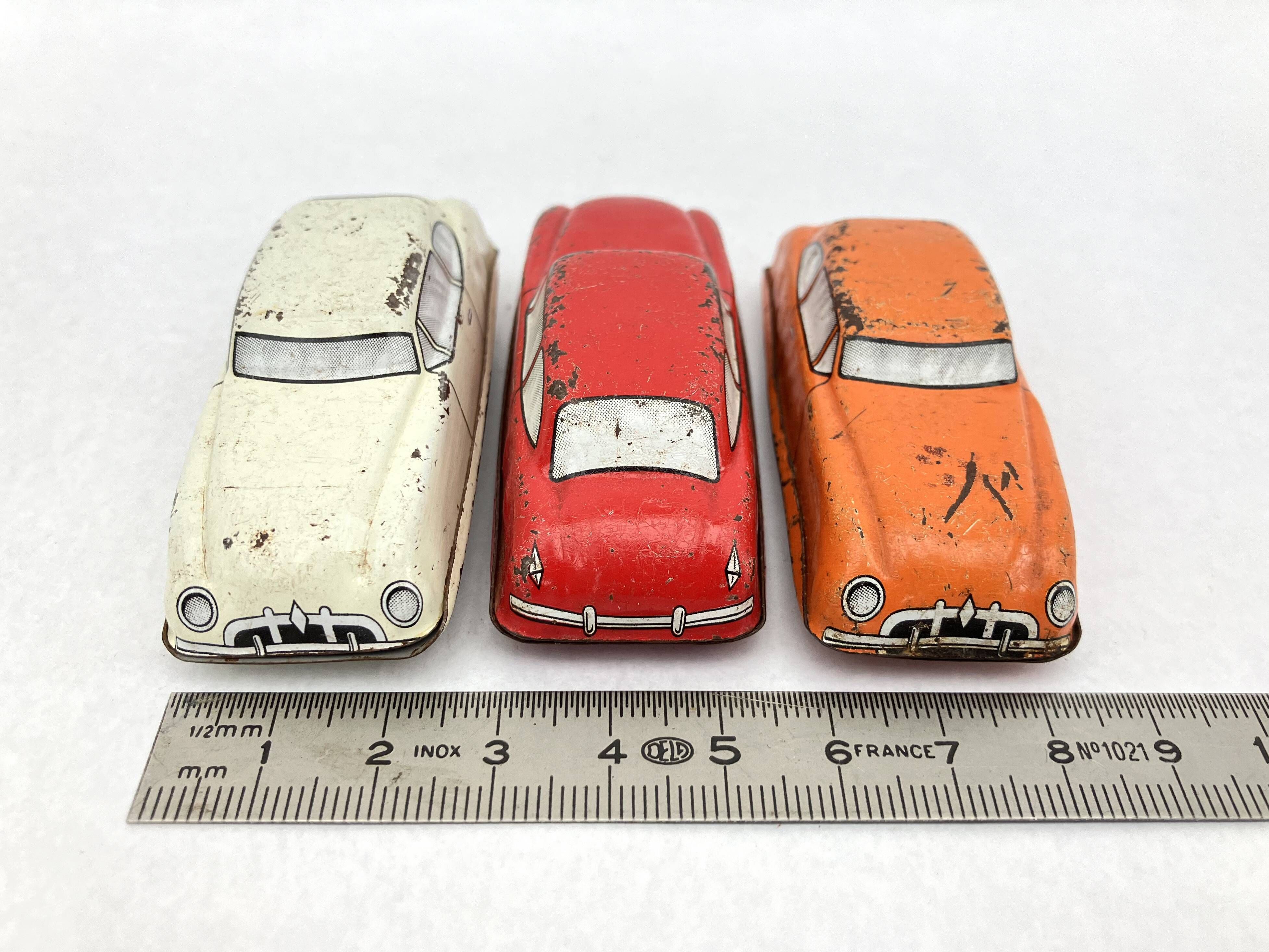 3 old small tin circuit cars with lead wheels • Vintage • 1960s