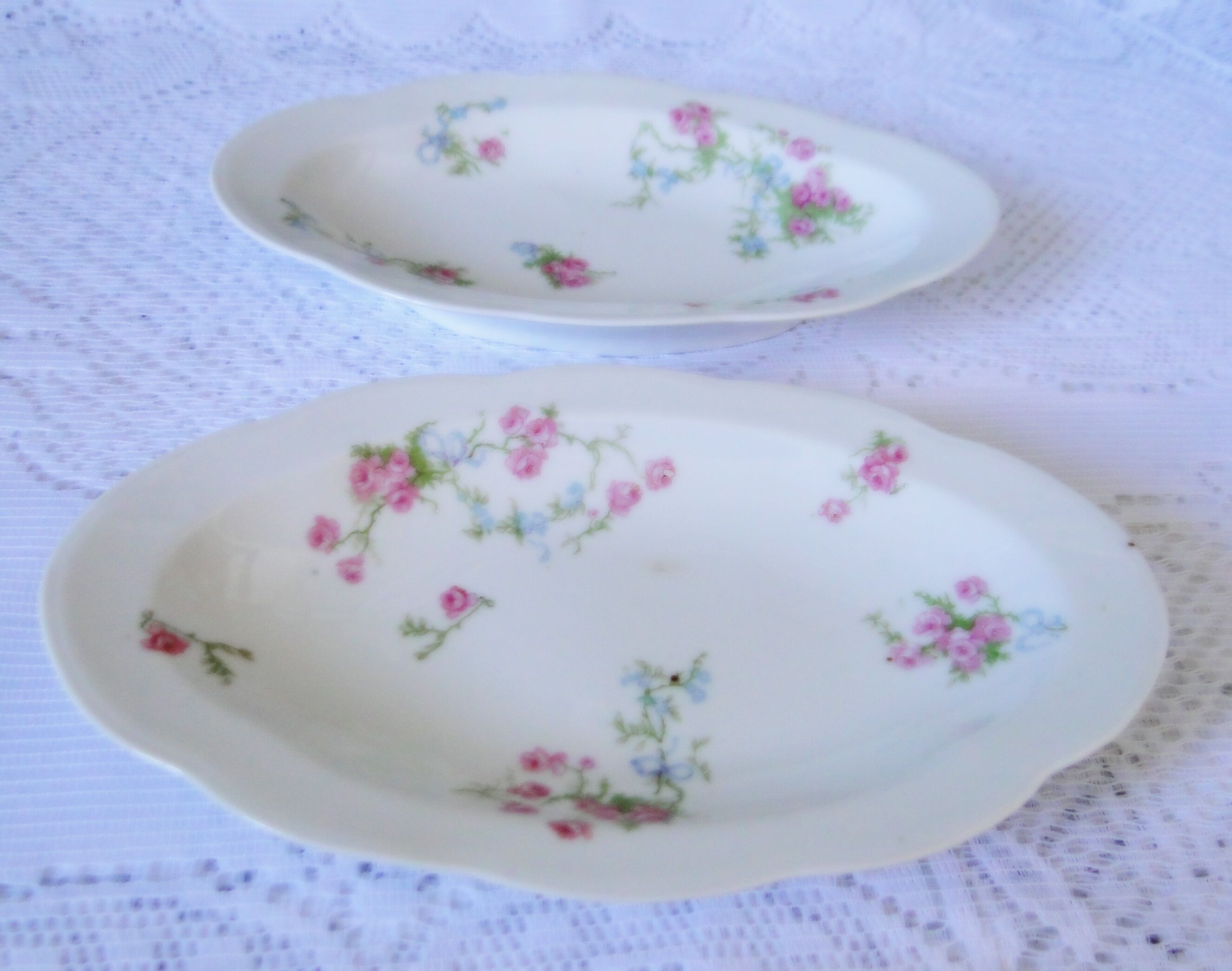 Lot 2 old porcelain raviers limoges decor petites roses on a white background
