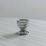 4 stainless steel egg cups.