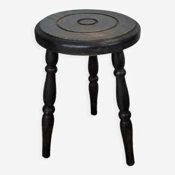 Black wooden tripod stool
