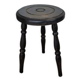 Black wooden tripod stool