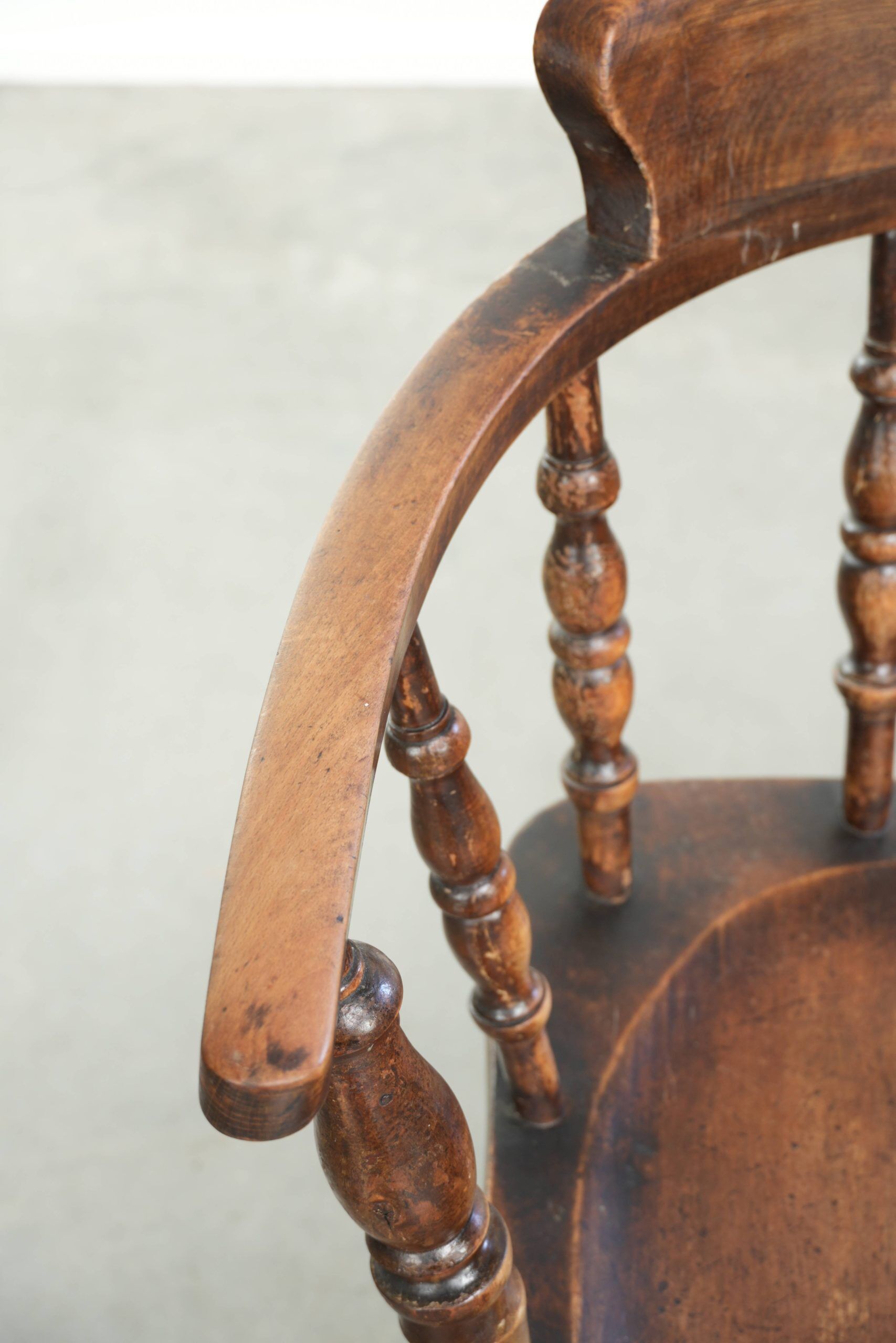 Wooden English antique pub/captain chair from the late 19th century