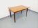 Rectangular dining table in vintage Scandinavian style made of teak and melamine.