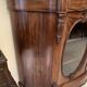 Curved mahogany display cabinet from the Napoleon III period. It has two doors and two shelves.