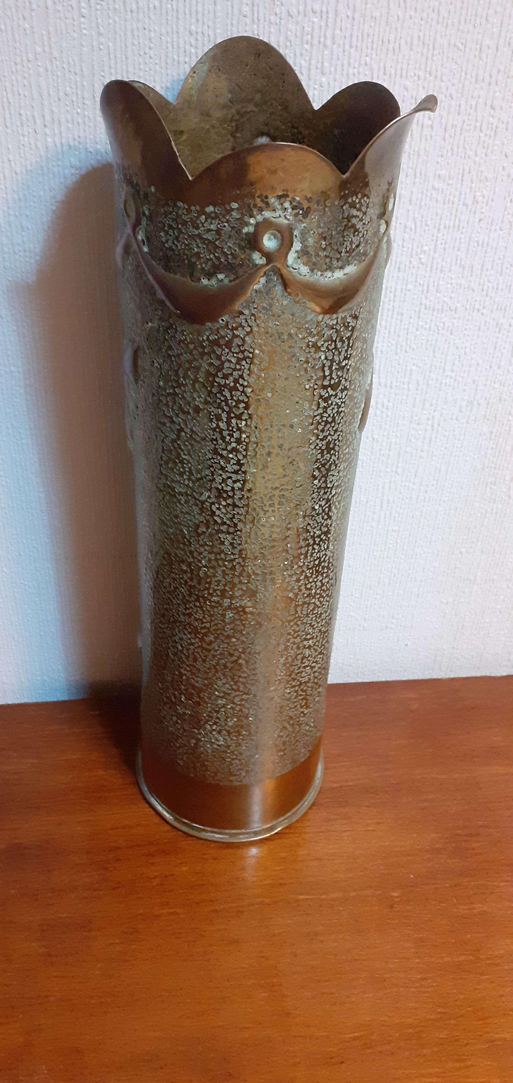 Shell casing vase carved into the trenches