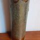 Shell casing vase carved into the trenches