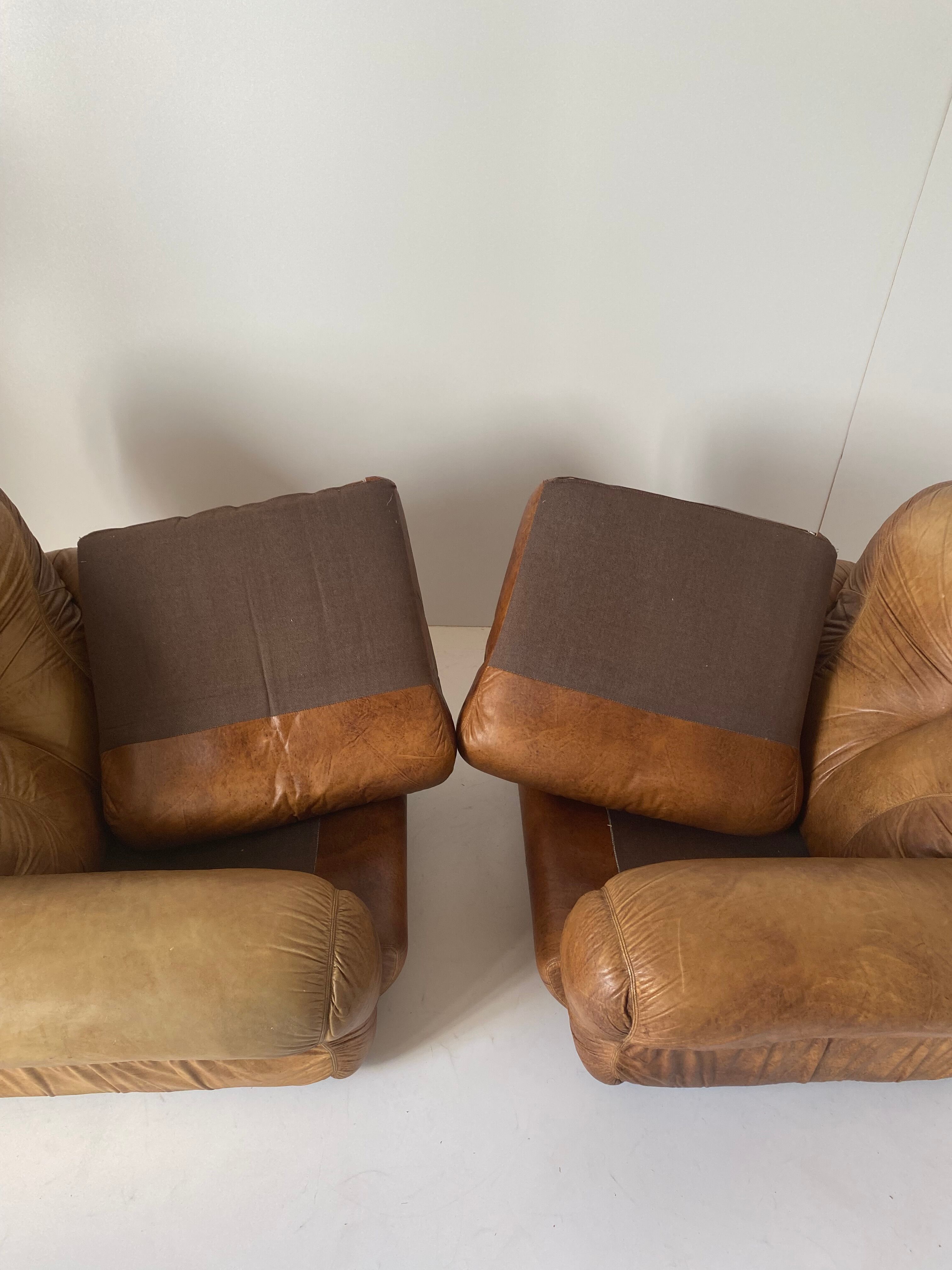 Pair of brown leather armchairs