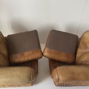 Pair of brown leather armchairs