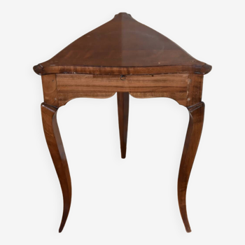 Solid wood pedestal table, triangular in shape, with small extractable shelf.