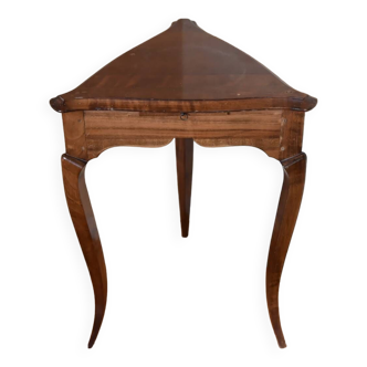 Solid wood pedestal table, triangular in shape, with small extractable shelf.
