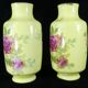 Pair of Limoges porcelain vases decorated with rose bushes