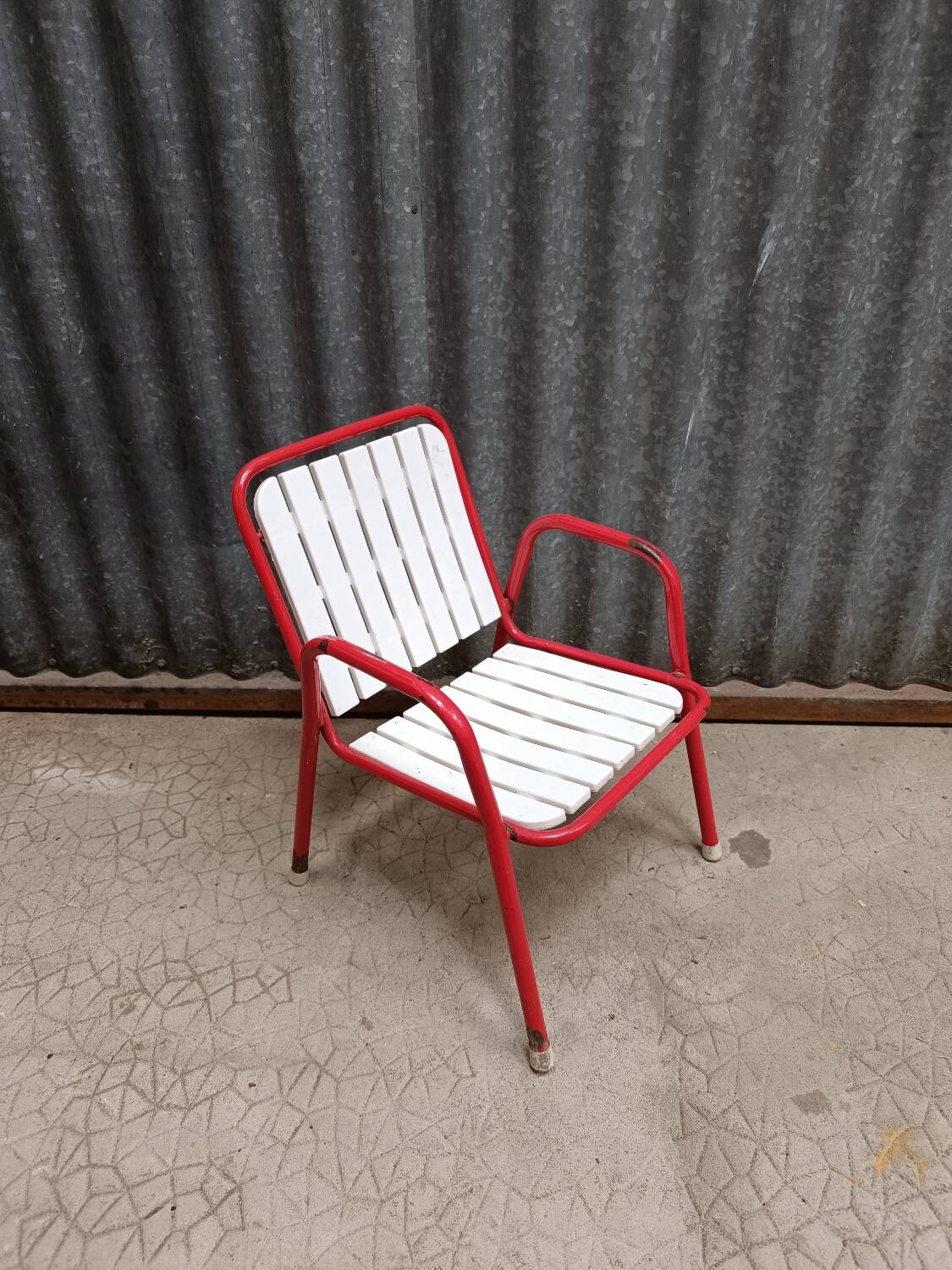 Red metal children's garden armchair
