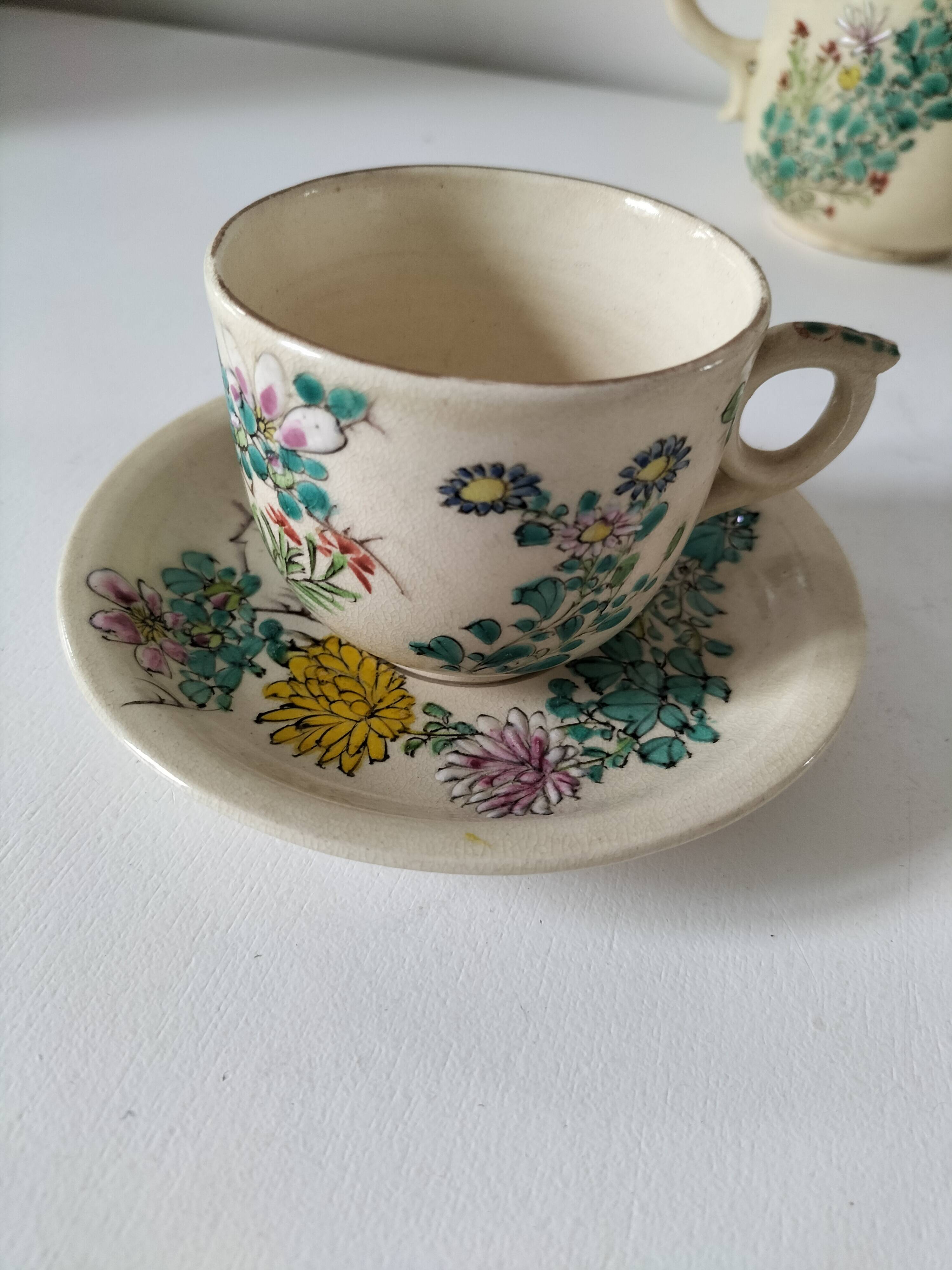 Japanese-style tea set in cracked earthenware with chrysanthemum flowers