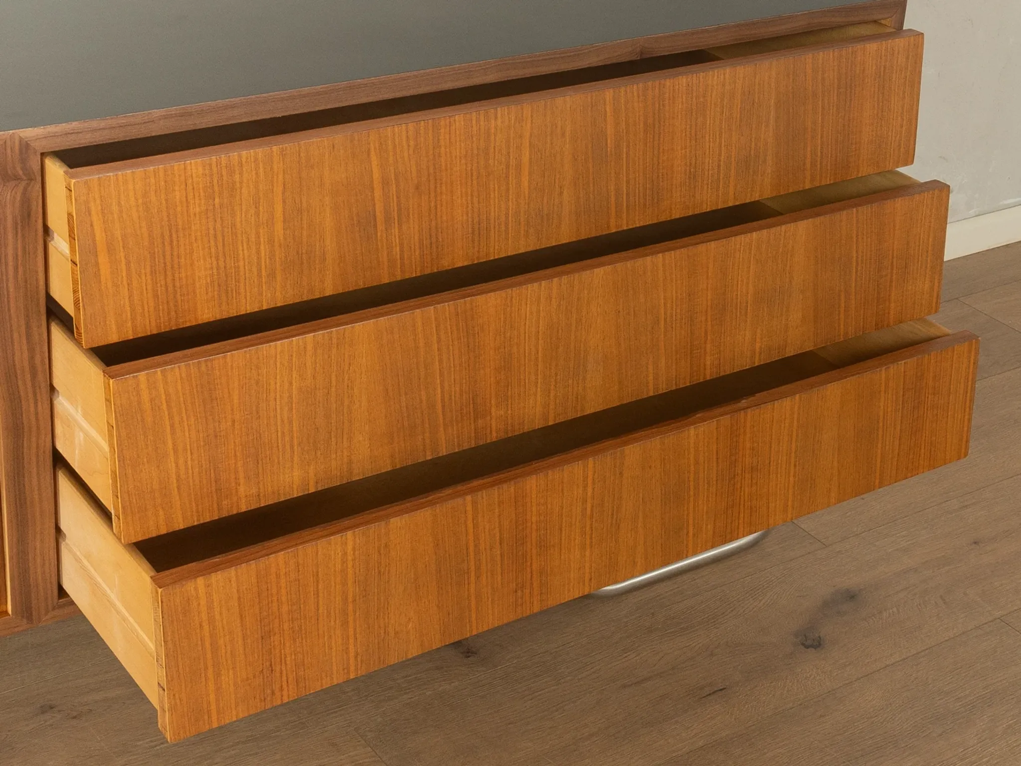 Striking mid-century sideboard with stainless steel base