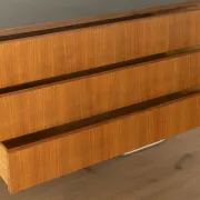 Striking mid-century sideboard with stainless steel base