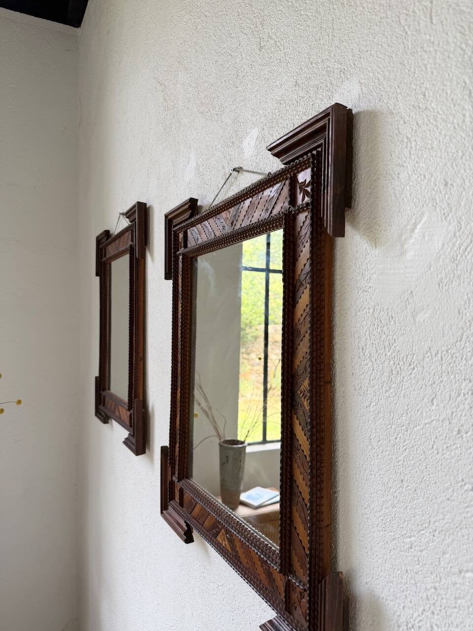 Pair of wooden mirrors in tramp art style