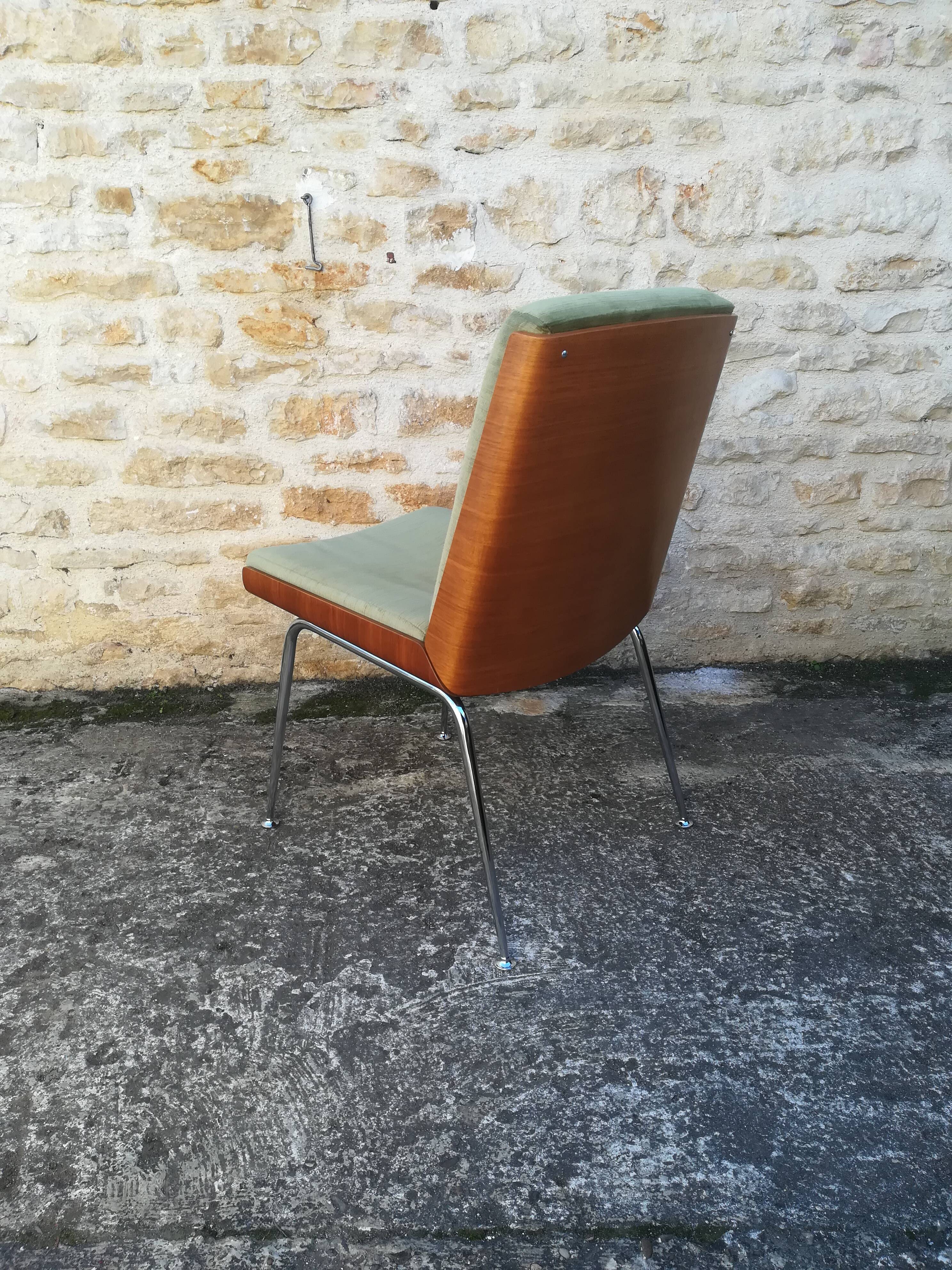 Shell chairs and green fabric