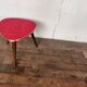 Triangular pedestal table small red table asymmetrical shape vintage tripod plant door