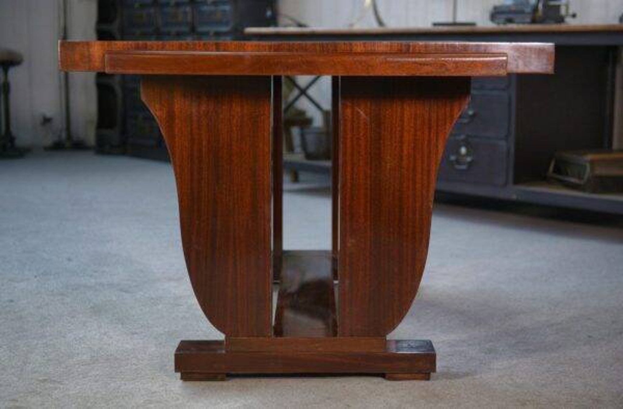 Art Deco mahogany veneer table in the style of Jules Leleu, 1930s