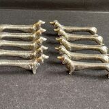 10 anciens porte-couteaux métal argenté zoomorphe (chien Teckel)