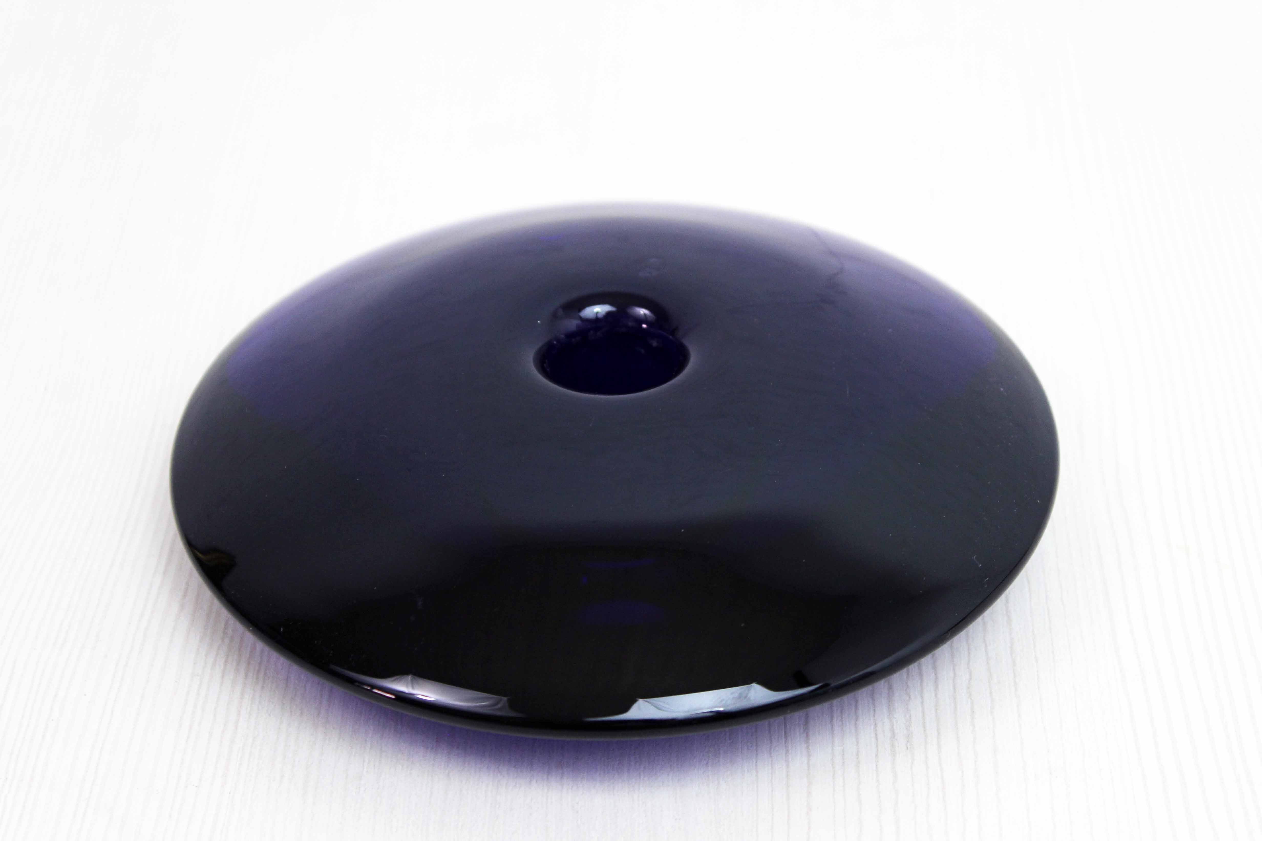 Blue glass saucer candle holder