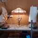 Large gilded brass lamp with white porcelain fleur-de-lis decoration