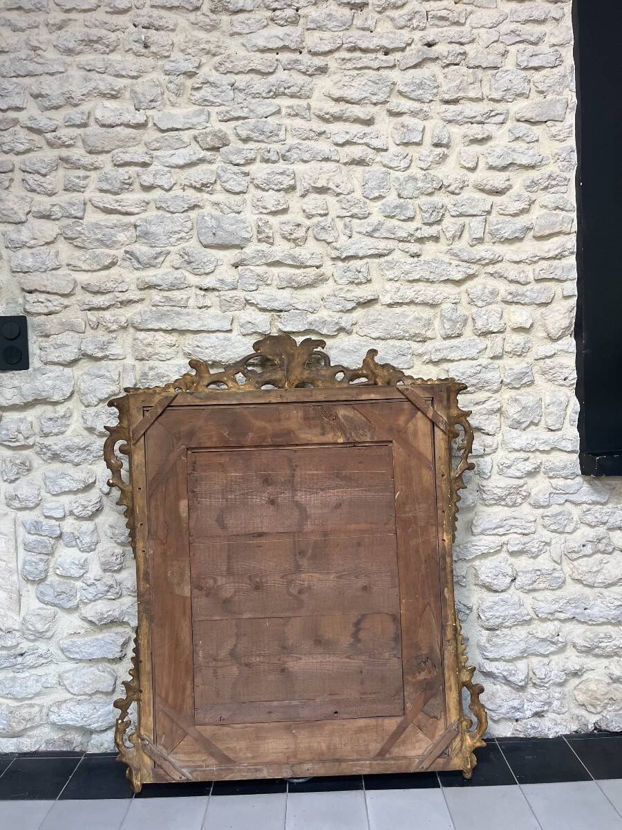 Antique mirror with a frame 123/100cm with gilded pediments, eagle heads, antique.
