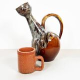 Large bird jug with high neck and handle, signed under the base