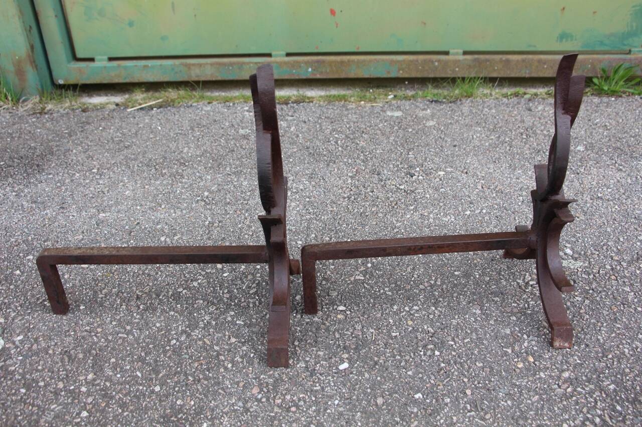 pair of andirons attributed to Raymond Subes, flame model