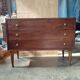 Vintage commode with tapered legs.