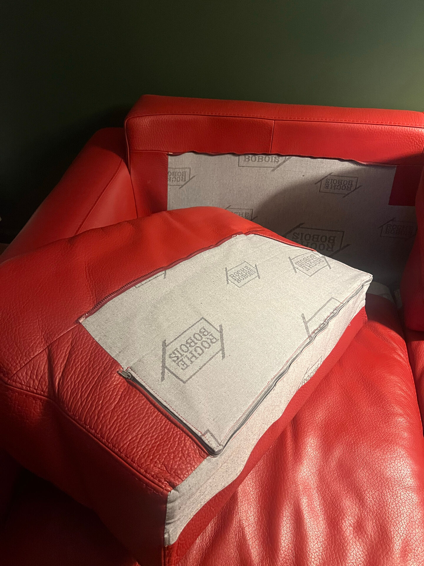 Red leather 2/3-seater sofa by Roche Bobois