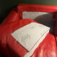 Red leather 2/3-seater sofa by Roche Bobois