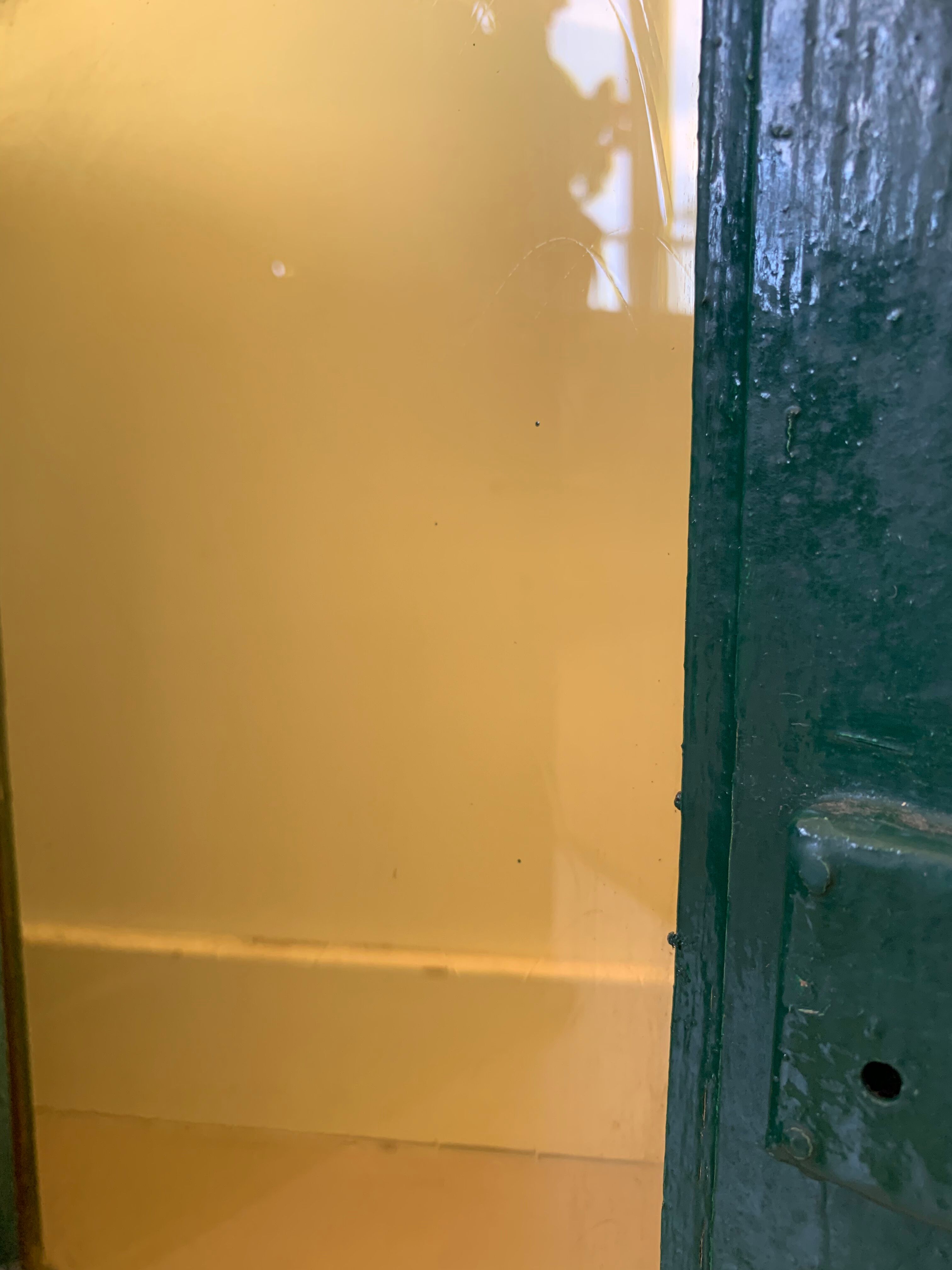 Wall vitrin with pediment