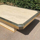 Vintage coffee table in travertine and brass.