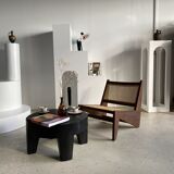 Reclined armchair in canned teak in natural wood