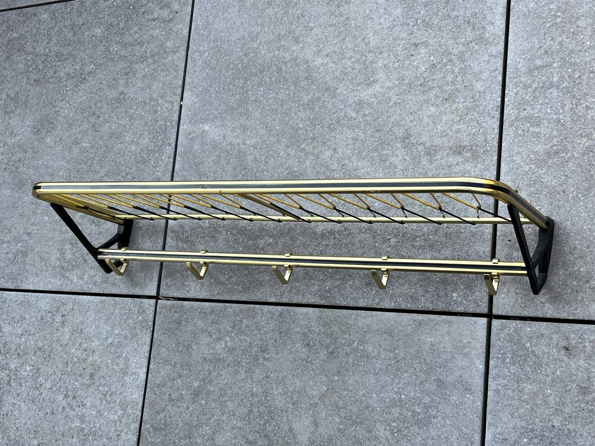 Coat rack in the style of a train luggage rack, length = 79 cm.