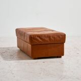 Ottoman with leather upholstery