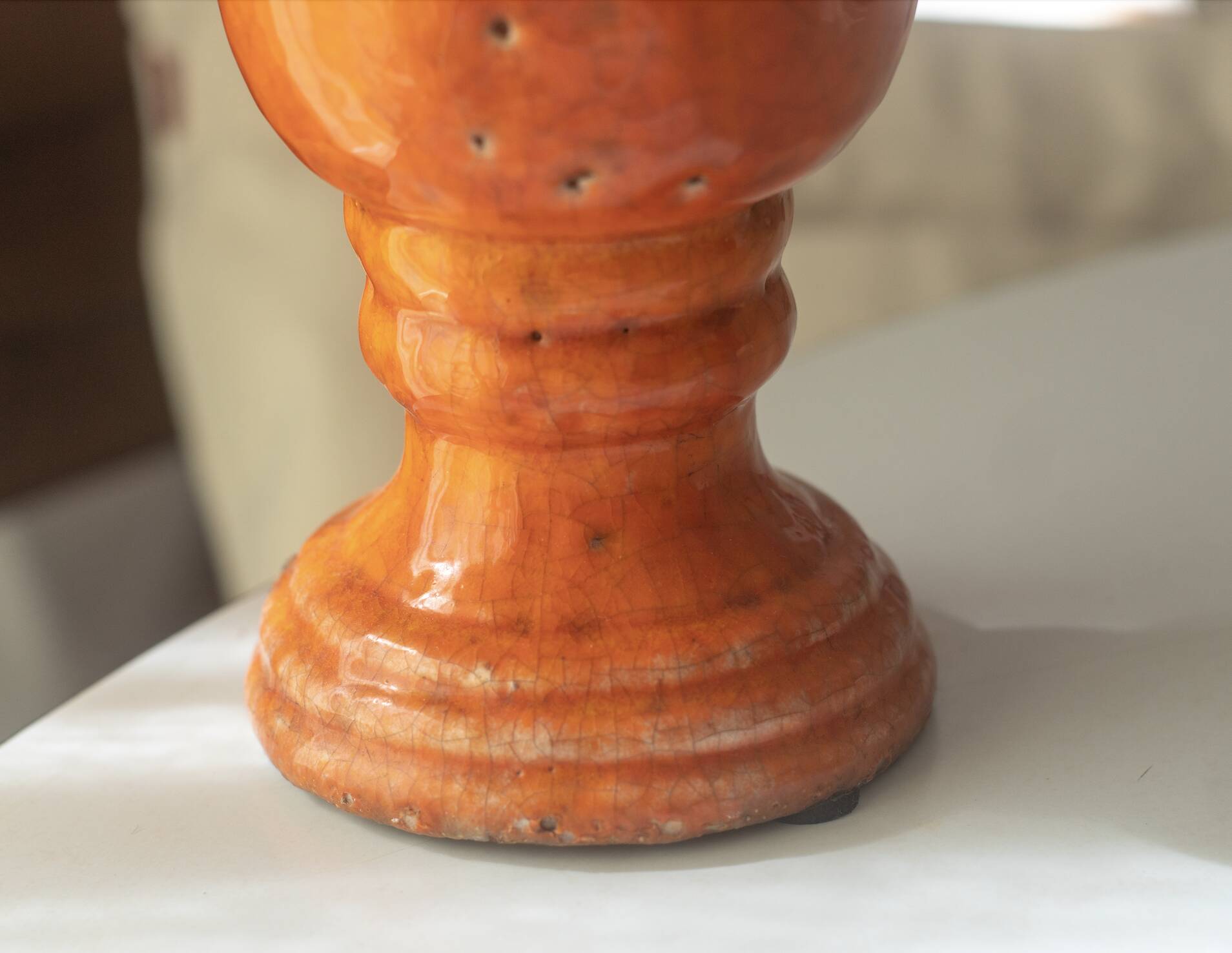 Orange glazed terracotta vase