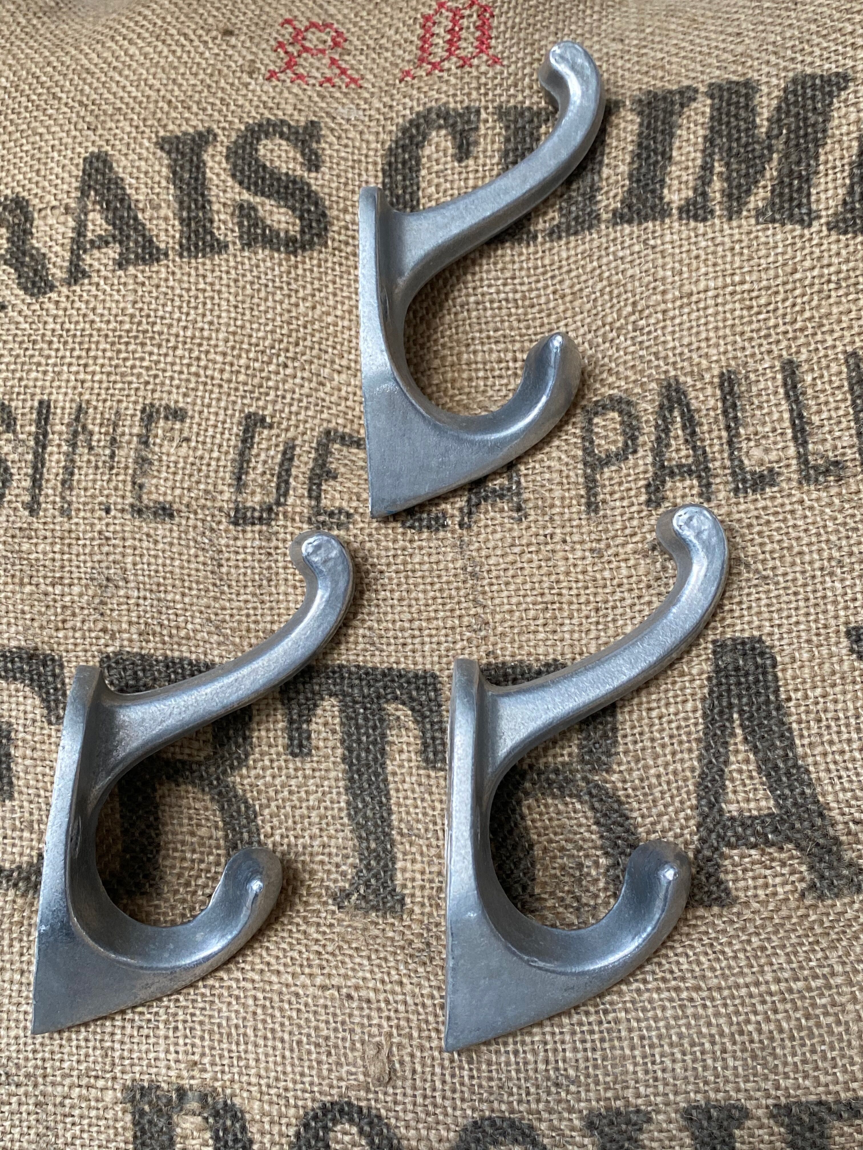 3 cast aluminum hooks