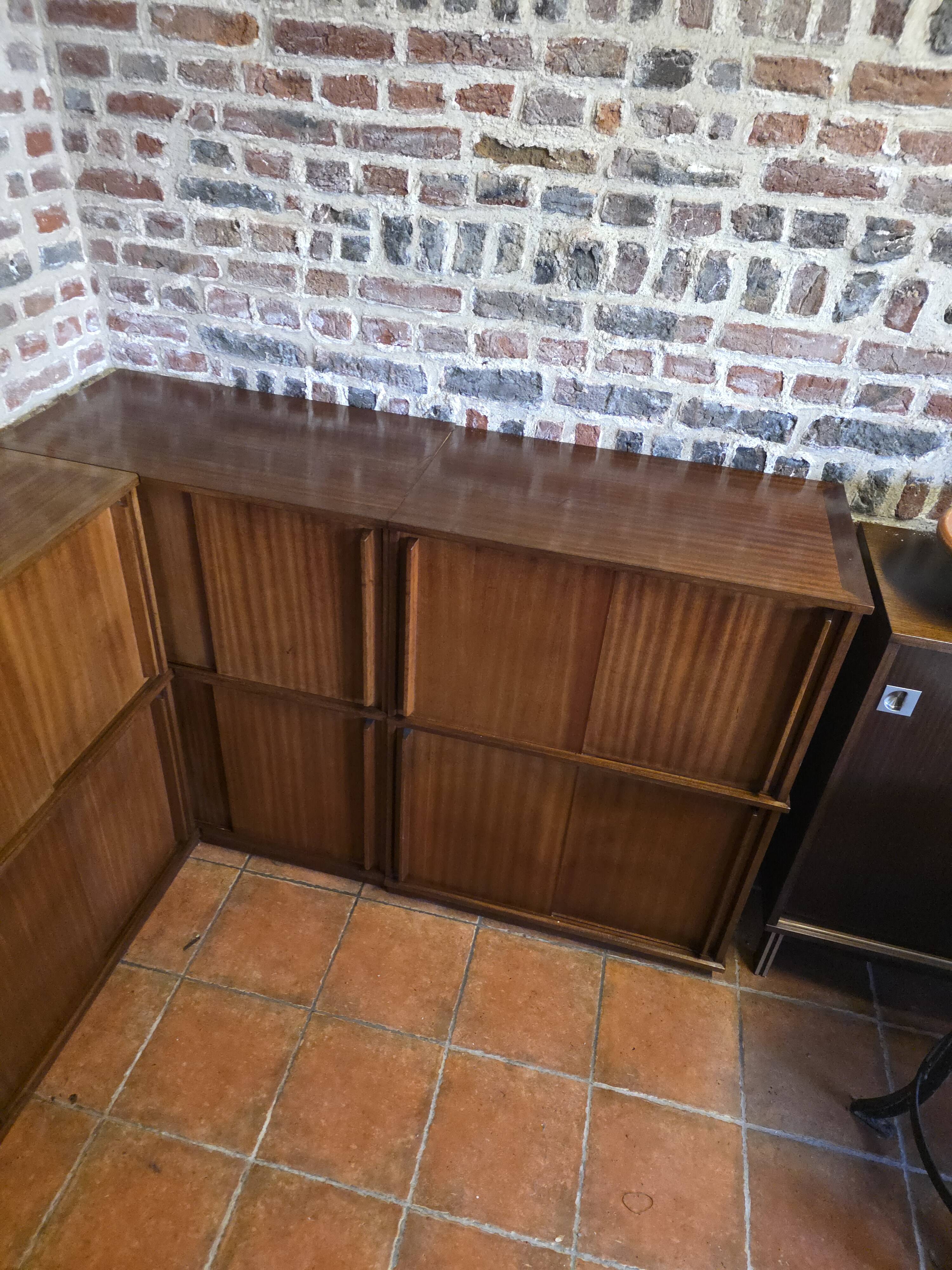Modular corner library Oscar from the 1960s with sliding doors.